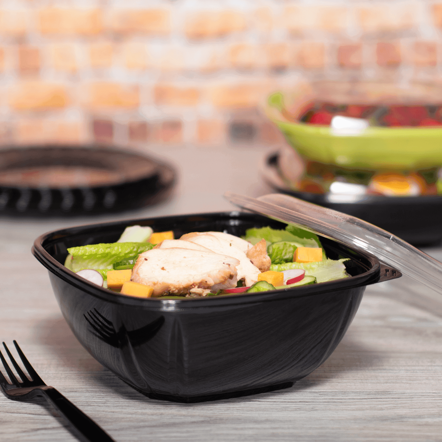 Black Karat 48oz PET Square Bowl with salad and grilled chicken