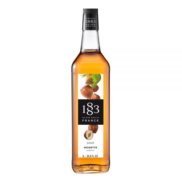 1883 Maison Routin Hazelnut syrup in a clear 1 Liter bottle.