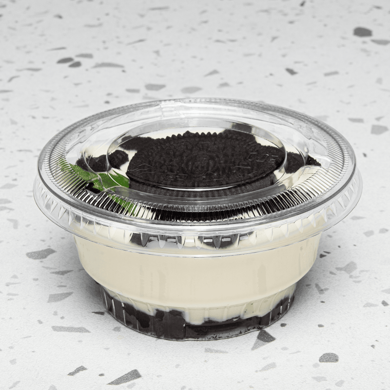 Karat 92mm PET Plastic Flat Lids with no holes on dessert cup with dessert and cookie inside