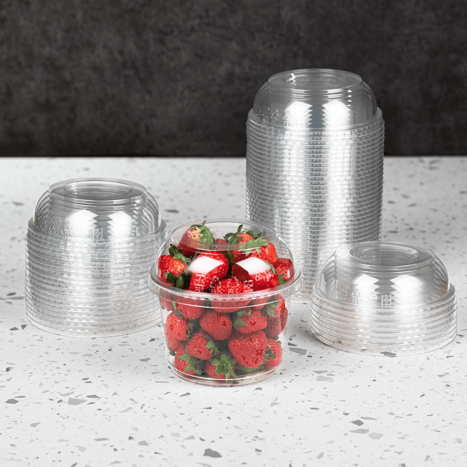 Karat PET Dome lid for 8-32oz with PET Round Deli Container filled with strawberries