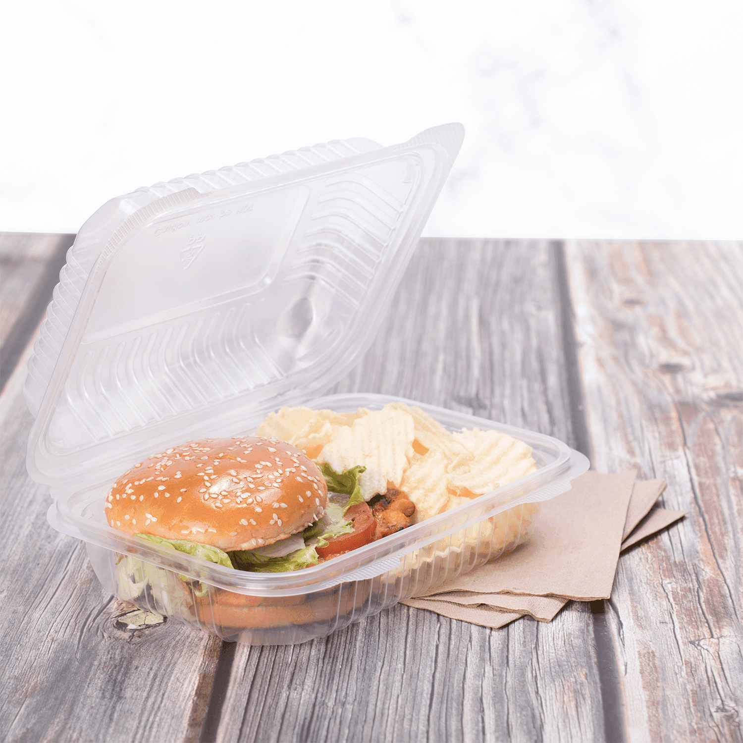 Clear Karat 9'' x 6" PP Plastic Hinged Container with burger and fries