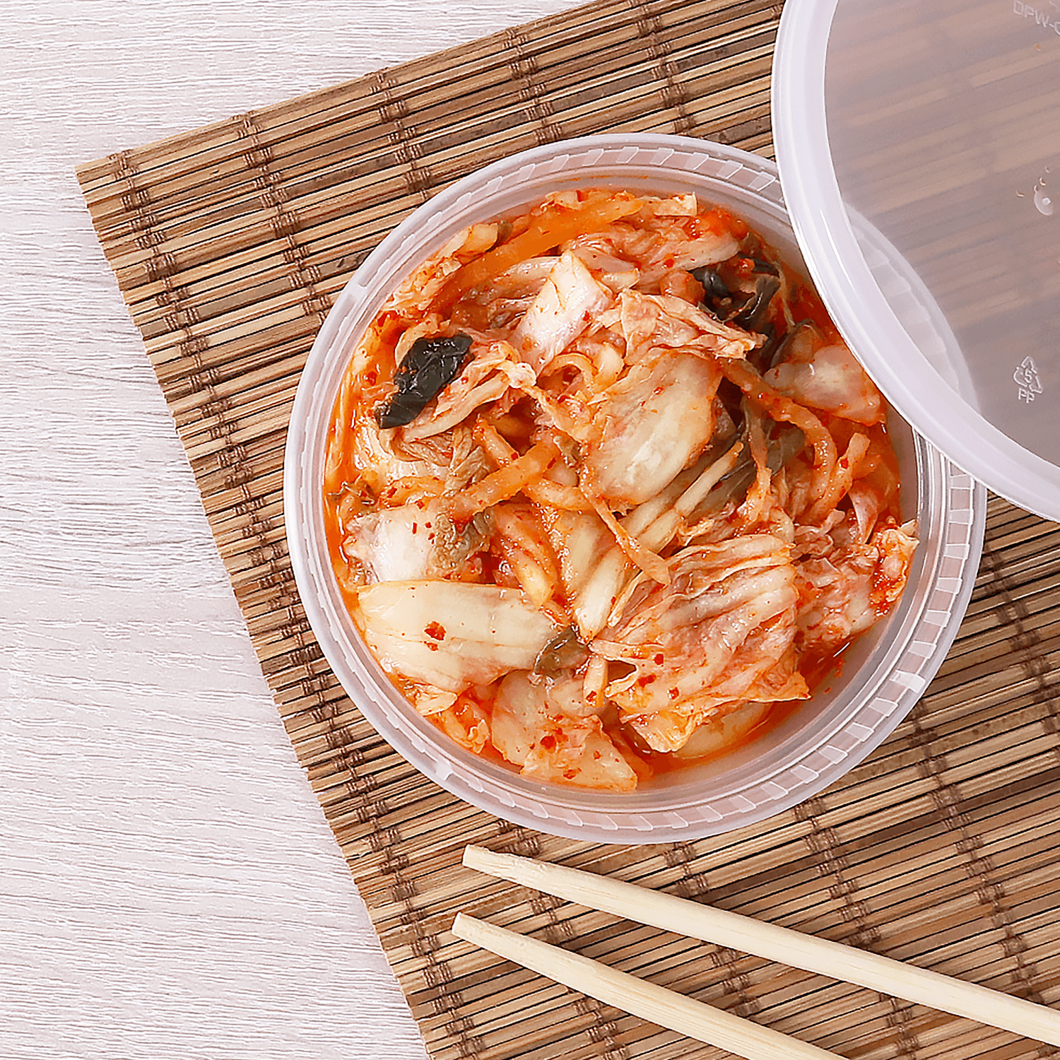 Clear Karat 8oz PP Plastic Injection Molded Deli Containers & Lids with kimchi and chopsticks