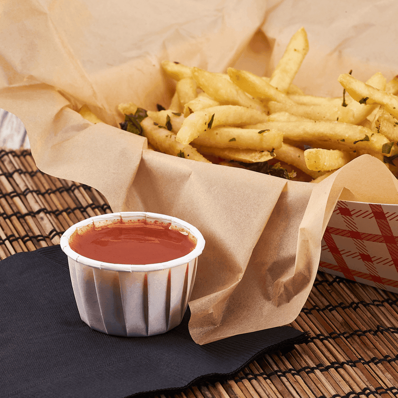 Karat 1.25 oz Paper Portion Cups with sauce and fries