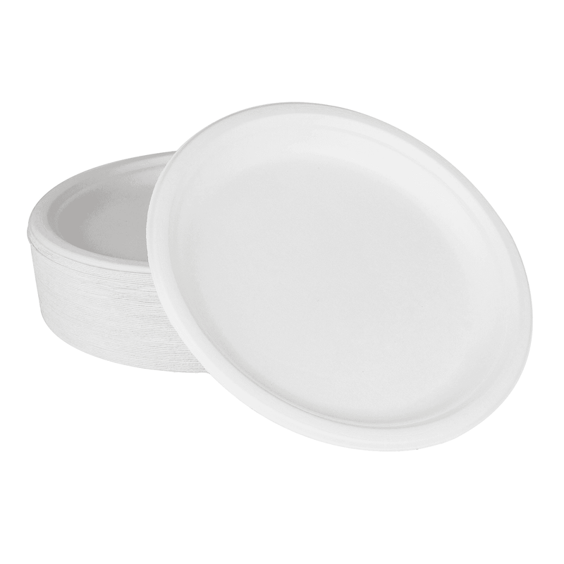 White Karat Earth 10'' PFAS Free Compostable Bagasse Round Plates stacked