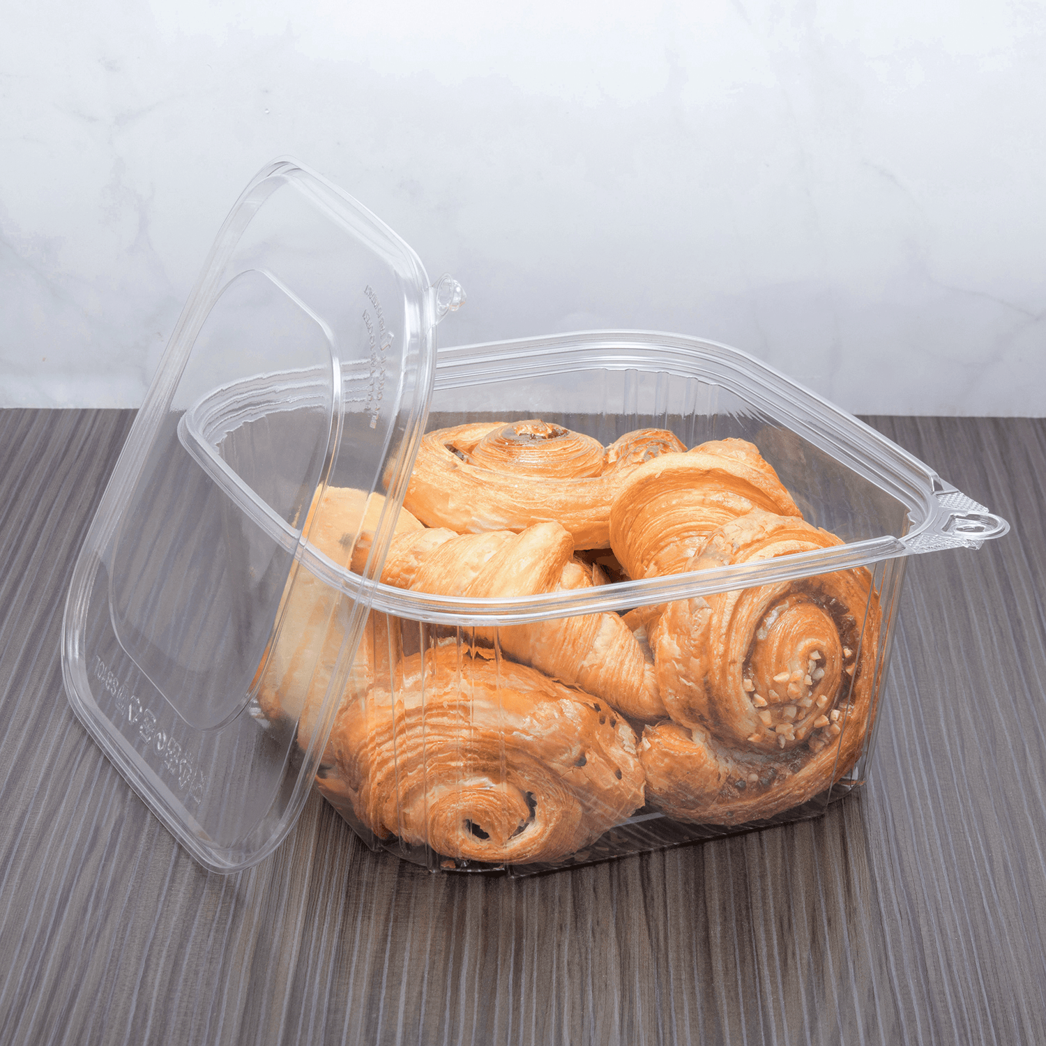 Clear Karat 64 oz PET Tamper Resistant Deli Container with Flat Lid  with baked goods