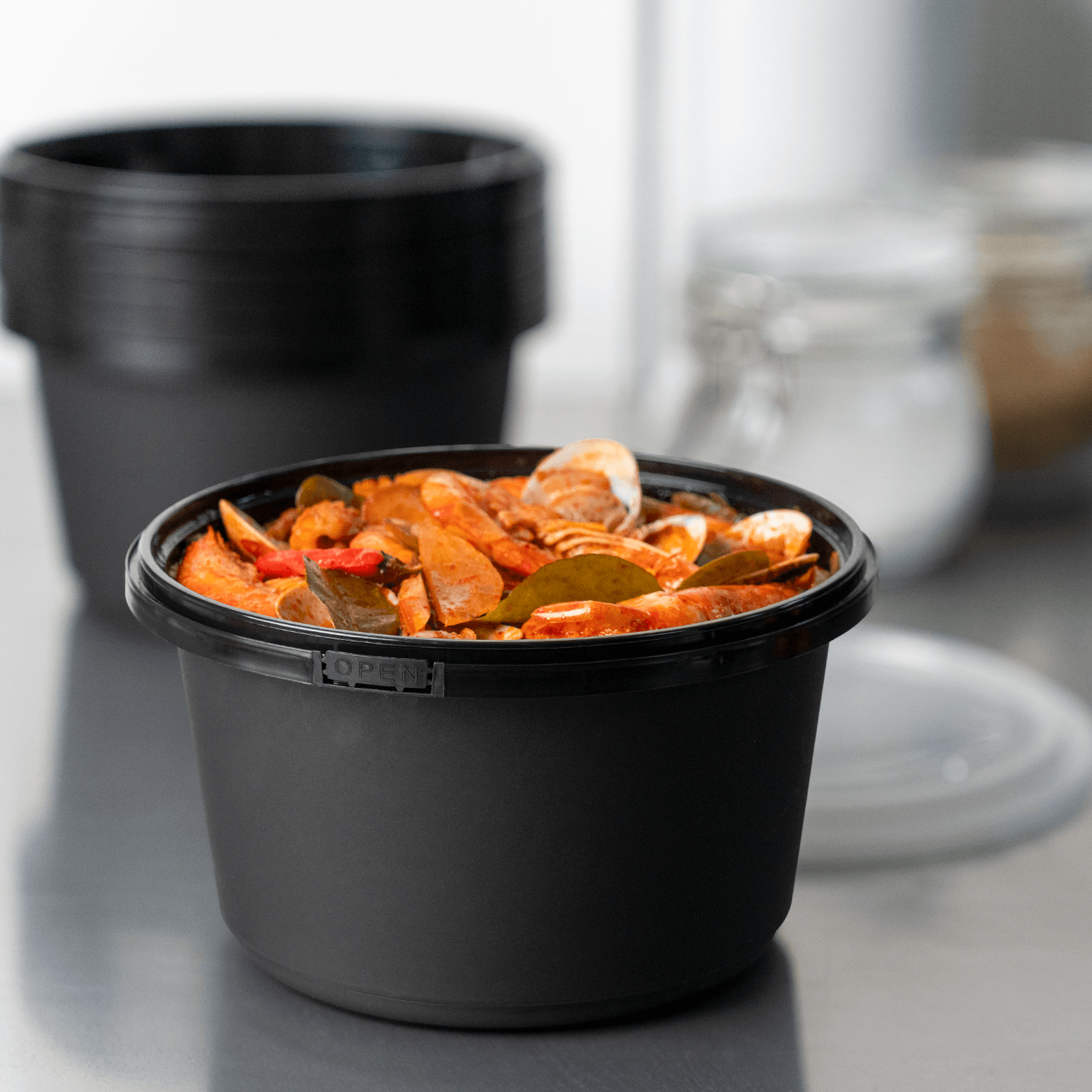 Karat 52oz PP Tamper Resistant Injection Molded Microwaveable Black Food Container w/Clear lid - 150 pcs