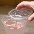 Clear Karat 98mm PET Plastic Flat Lids on matching clear cup