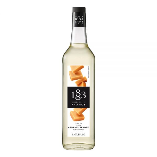 1883 Maison Routin Caramel Tendre syrup in a clear 1 Liter bottle.