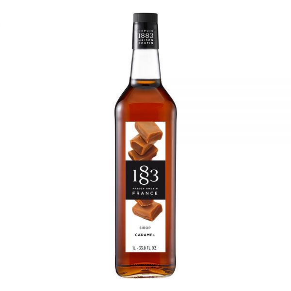 1883 Maison Routin Caramel syrup in a clear 1 Liter bottle.