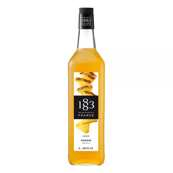 1883 Maison Routin Pineapple syrup in a clear 1 Liter bottle.