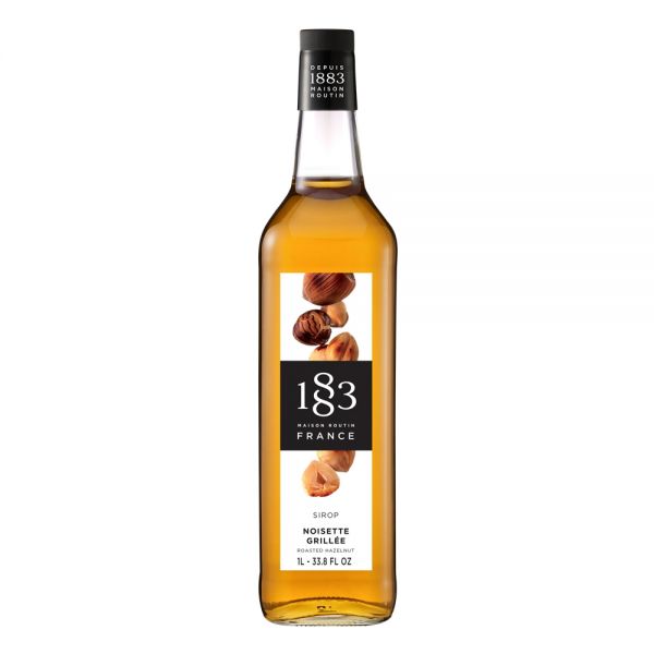 1883 Maison Routin Roasted Hazelnut syrup in a clear 1 Liter bottle.