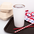 White Karat 44 oz Cold Paper Cup with clear lid on serving tray with straws