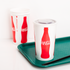 Coca Cola Print Karat 44oz Paper Cold Cups on serving tray with matte flat lid and black straw