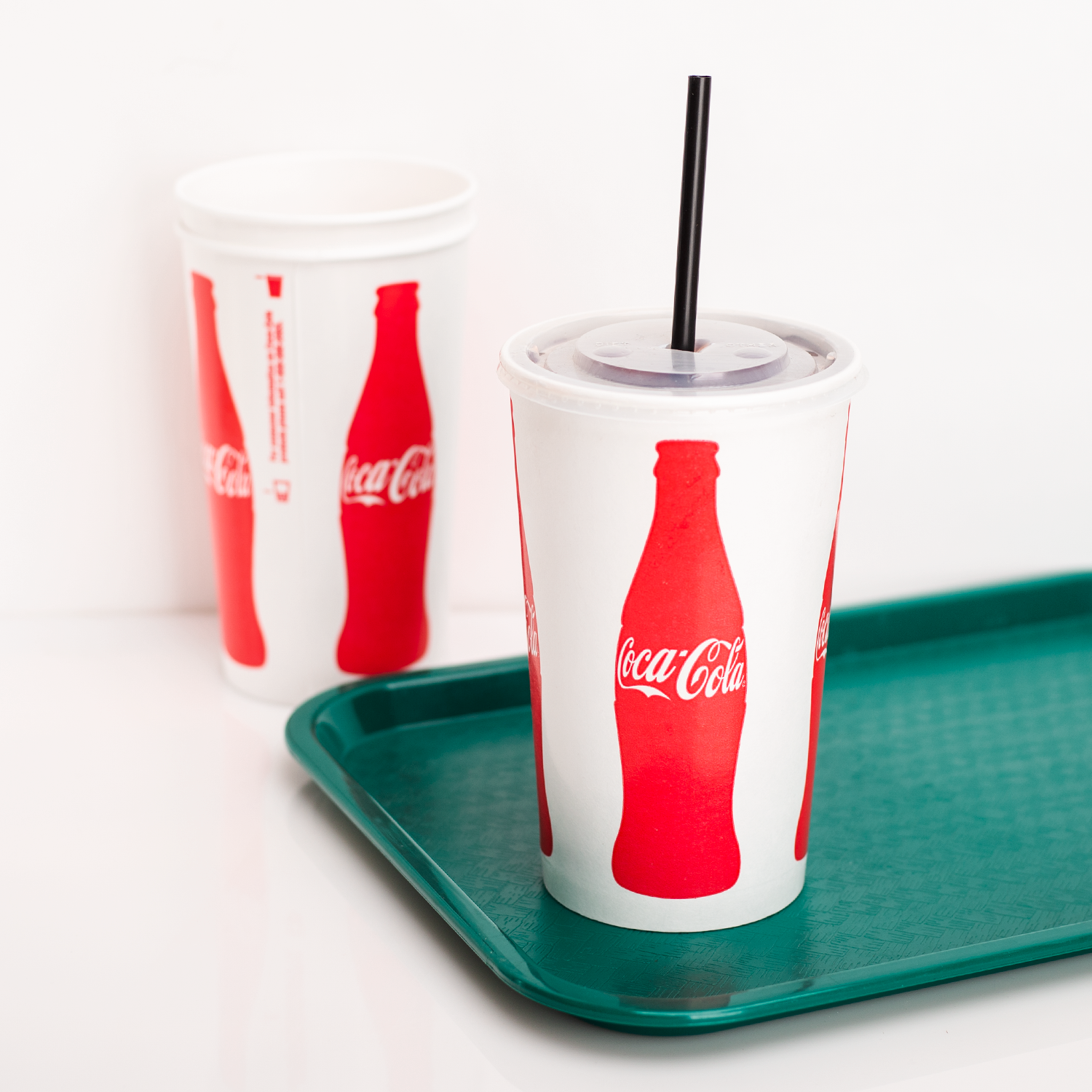 Coca Cola Print Karat 44oz Paper Cold Cups with flat lid, black straw, and serving tray