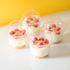 Clear Karat 8oz PET Plastic Dessert Cup with raspberry cheesecake and dome lid