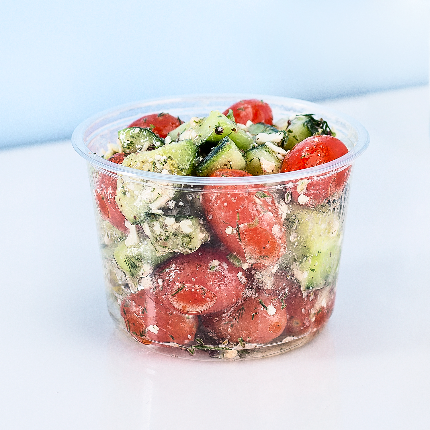 Clear Karat 16oz PET Round Deli Container with vegetable salad