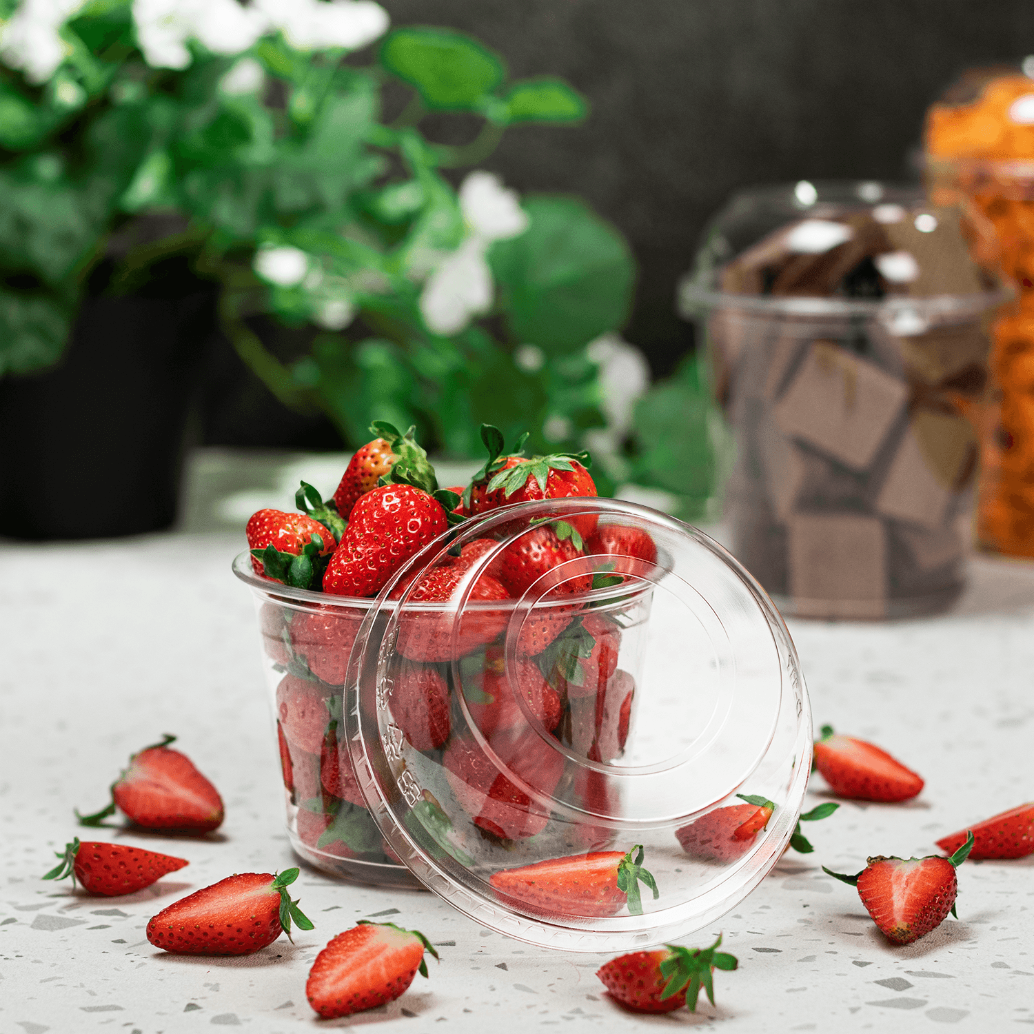 Karat PET Dome lid for 8-32oz with PET Round Deli Container filled with strawberries