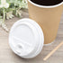 White Karat 10-24oz Enclosure Lid beside cup and stirrer