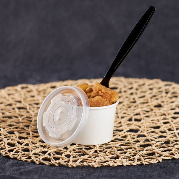 Clear Karat 4oz PP Plastic Food Container Flat Lids with matching container filled with chicken