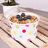 Dot print Karat 20oz Food Container with a yogurt parfait and dome lid