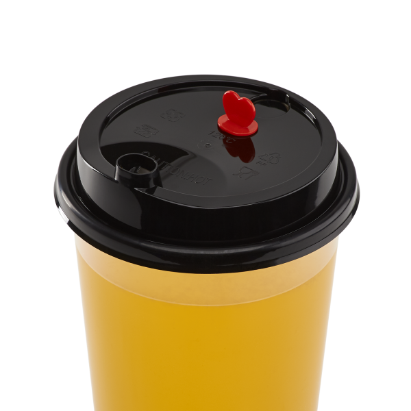 Black Karat 90mm Sipper Dome Lid for 16/24 oz Tall Premium PP Plastic Cup on matching cup with yellow drink