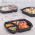 Karat 36 oz PP Plastic Microwaveable Black Take Out Box with 3 compartments with matching clear lid, chicken, and vegetables