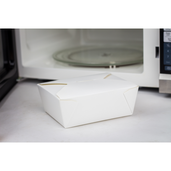 White Karat 48 fl oz Fold-To-Go Box next to microwave