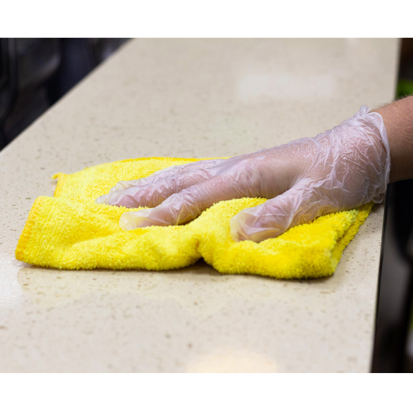 Karat Vinyl Powder-Free Gloves being used while cleaning