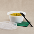 White Karat 36oz PP Plastic Injection Molding Bowl with fried rice, matching clear lid, green napkin, and black fork