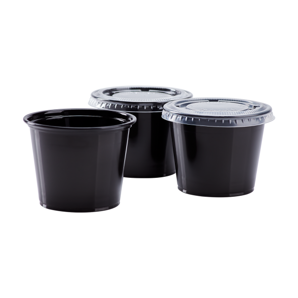 Clear Karat 3.25 oz - 5.5 oz PET Portion Cup Lids on black portion cup