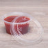 Clear Karat 1oz Squat-2oz PET Plastic Portion Cup Lid with clear cup filled with ketchup