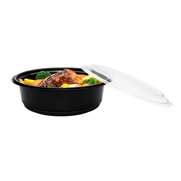 Black Karat 48 oz PP Round Microwaveable Container with food and lid to the side