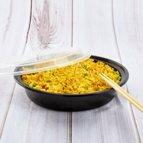 Karat 48 oz PP Plastic Microwavable Round Food Containers & Lids with fried rice and chopsticks