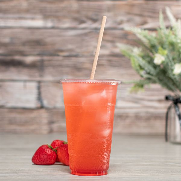 Kraft Karat Earth 10.25" Paper Jumbo Straw Paper Wrapped in strawberry flavored drink in clear cup