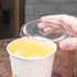 Karat Earth 12-22oz PLA Lids with matching cup and yellow drink