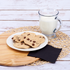 Karat 10"x10" Black Beverage Napkin beside cookies and milk