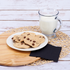 Black Karat 10"x10" Premium Beverage Napkin beside cookies and milk