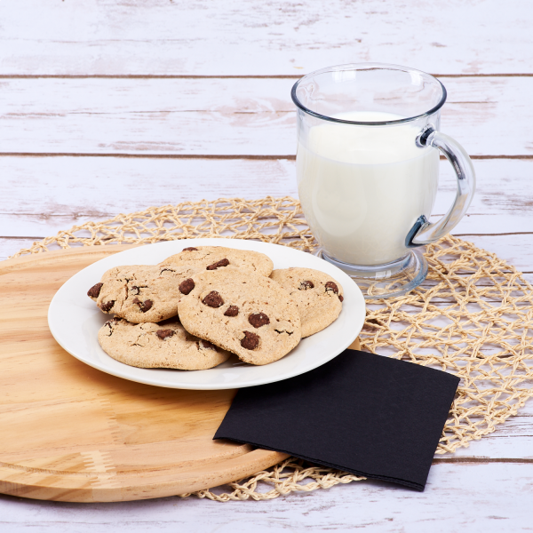 Black Karat 9.5"x9.5" Beverage Napkins next to cookies and milk