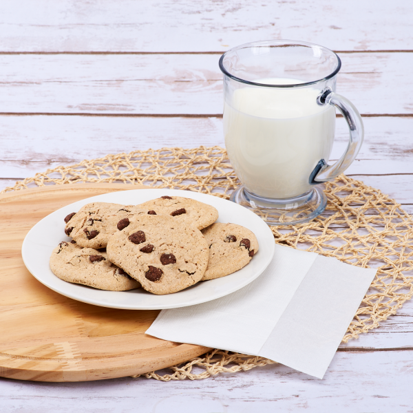 White Karat 12"x13" Off-Fold Napkin beside cookies and milk