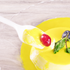White Karat PS Plastic Medium Weight Tea Spoon being used with flan